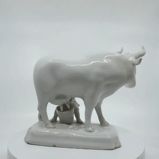 white Delftware milking group